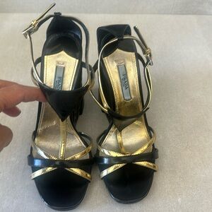 Prada Wedges in black and gold.